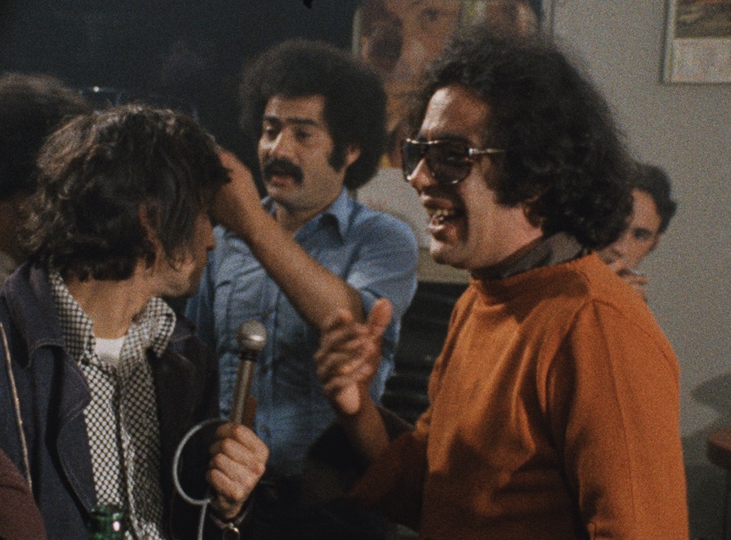 Mostafa Derkaoui (amb camisa blava)